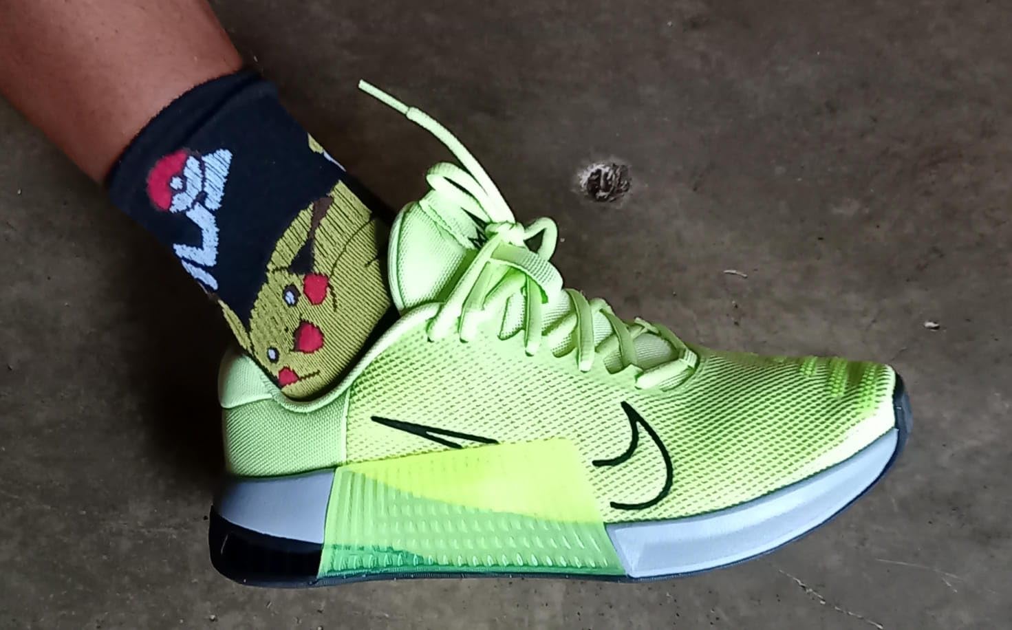 Nike Metcon 9 on gym floor showing traction pattern and stability during workout