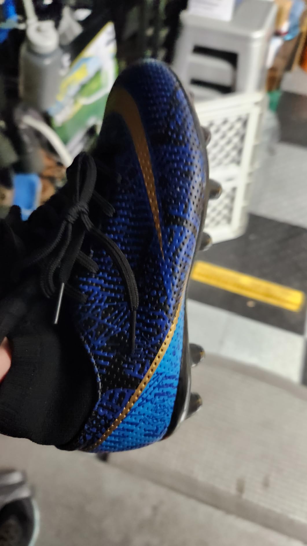 Youth soccer cleats being tested on different field surfaces showing versatility
