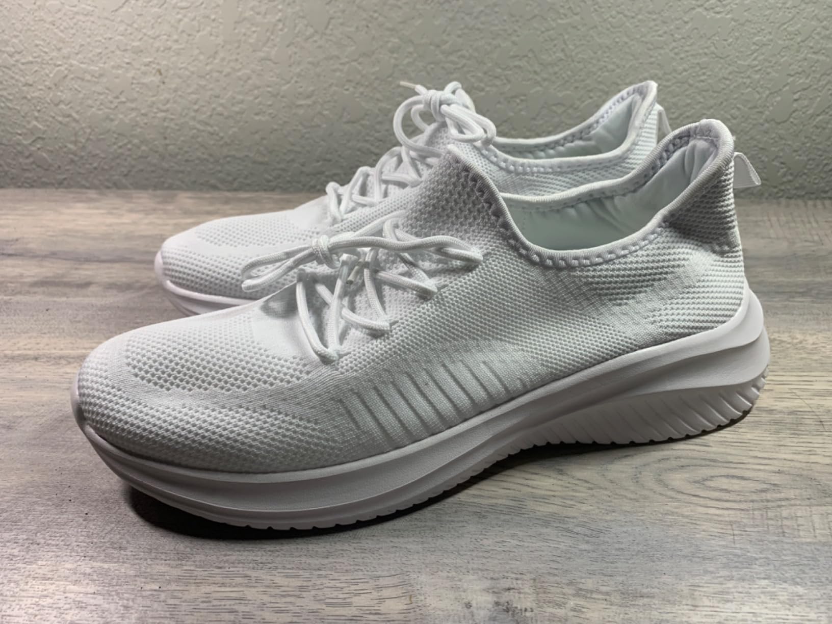 LCGJR men's walking shoes lifestyle shot showing clean white design and versatile casual styling