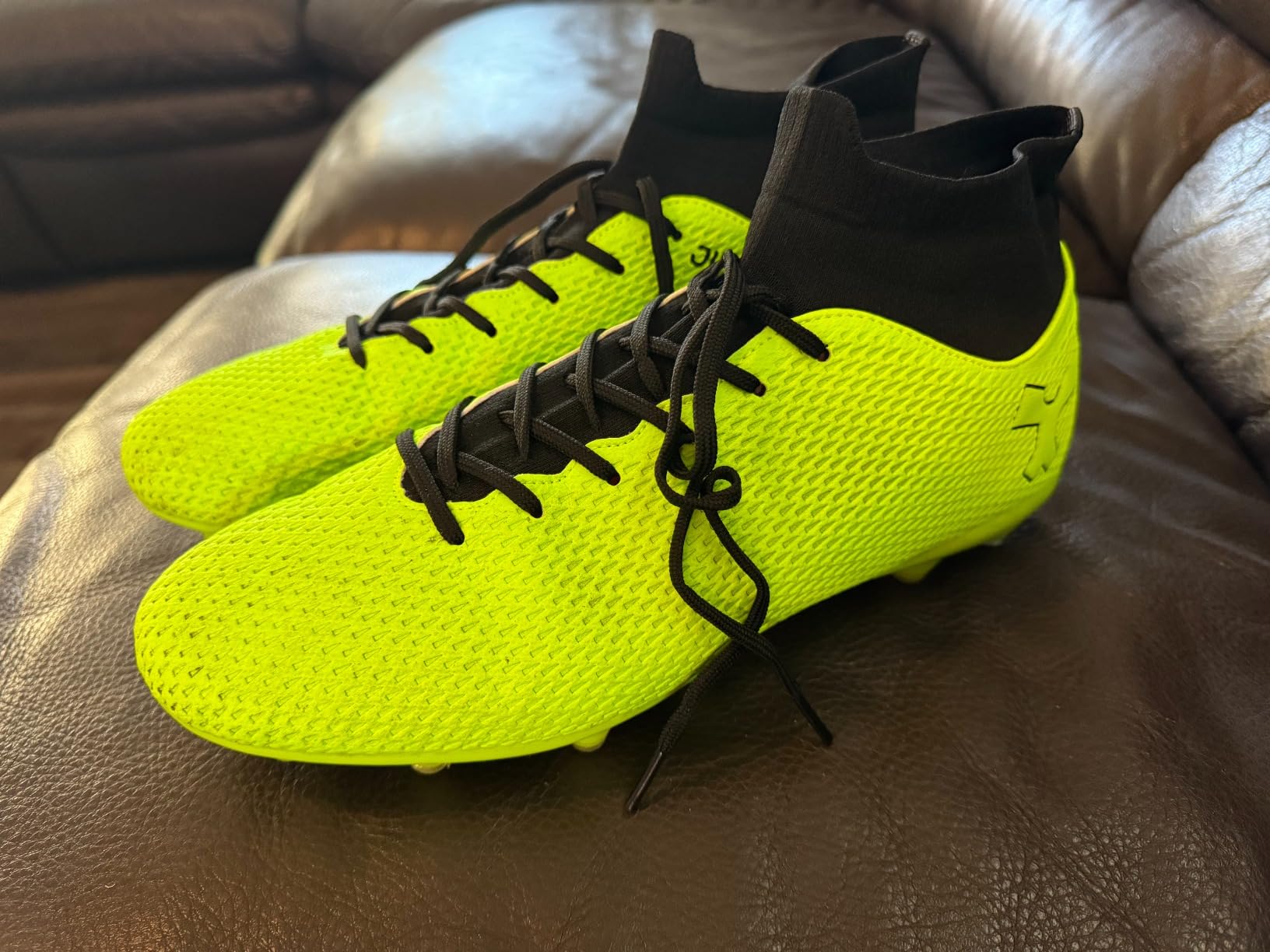Soccer cleats being tested on grass field during training