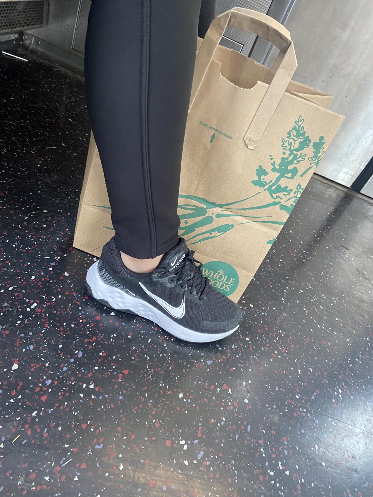 Nike Women's Road Running Shoes showing full side profile and branding details