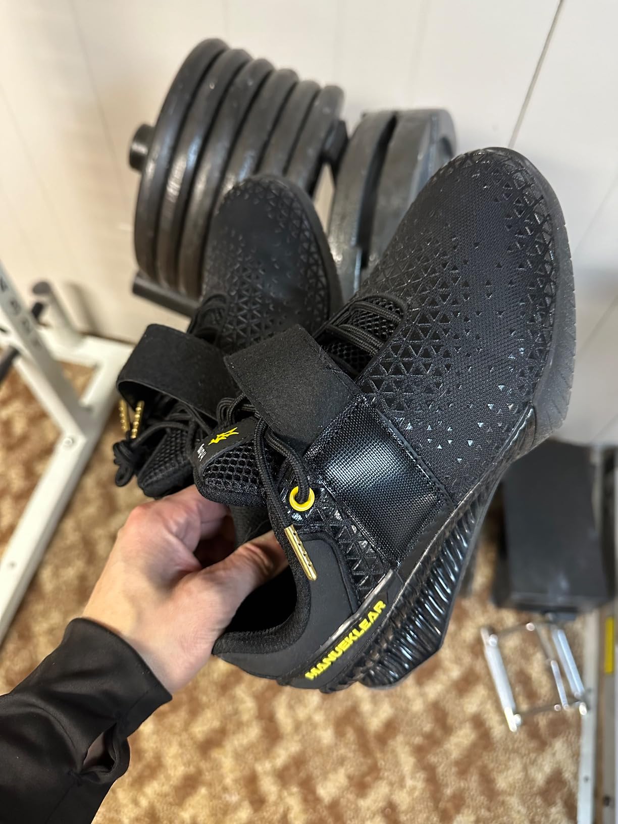 MANUEKLEAR lifting shoes in action showing proper squat form and stability