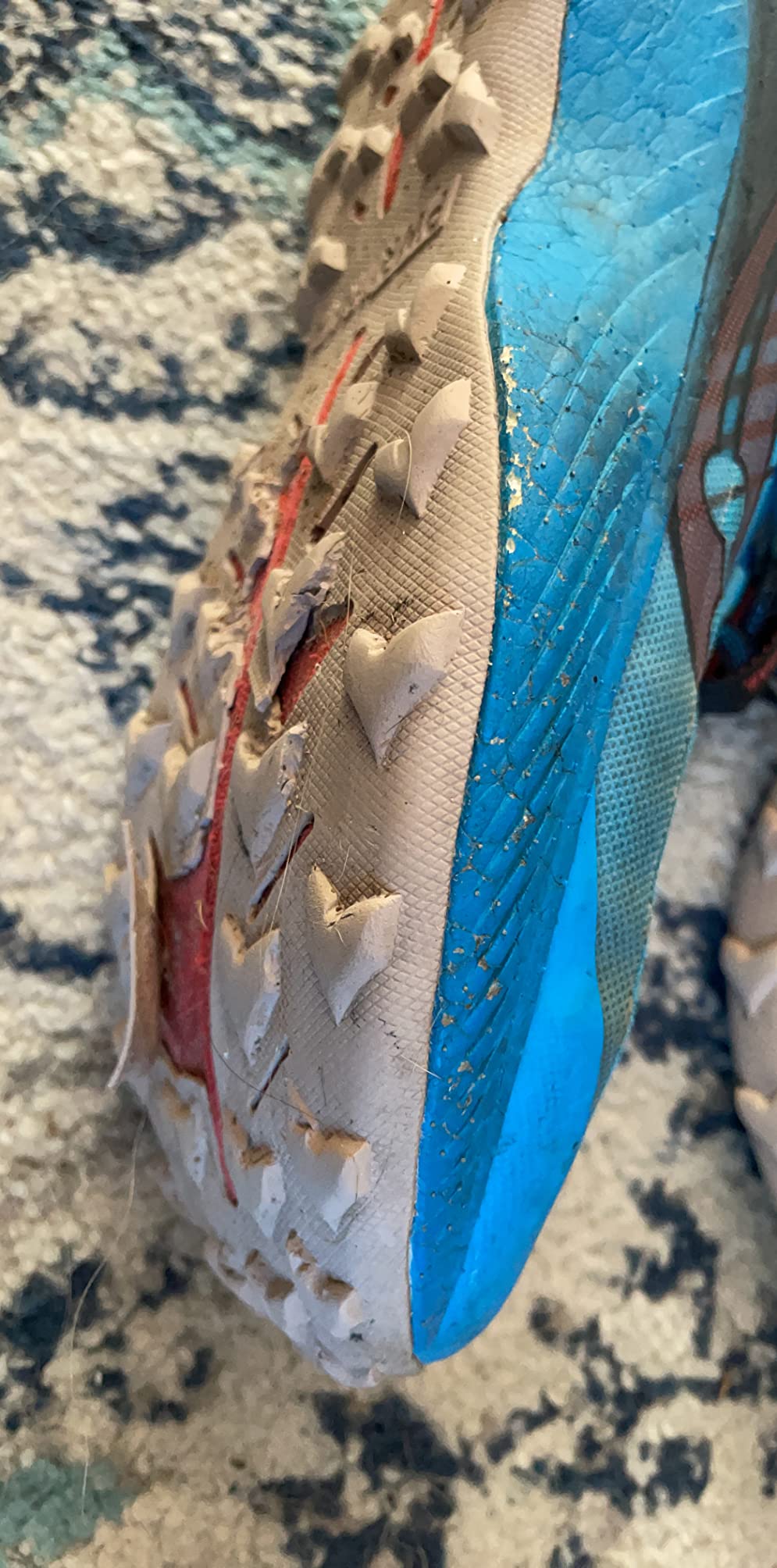 Saucony Endorphin Edge showing significant tread wear and foam degradation after limited use