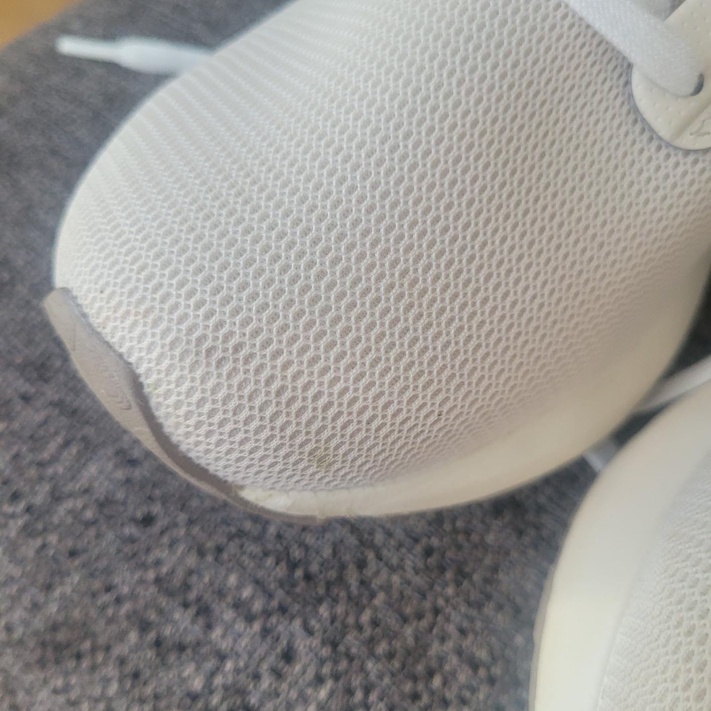 New Balance Fresh Foam X 1440 detail shot showing knit mesh construction and TPU heel clip design