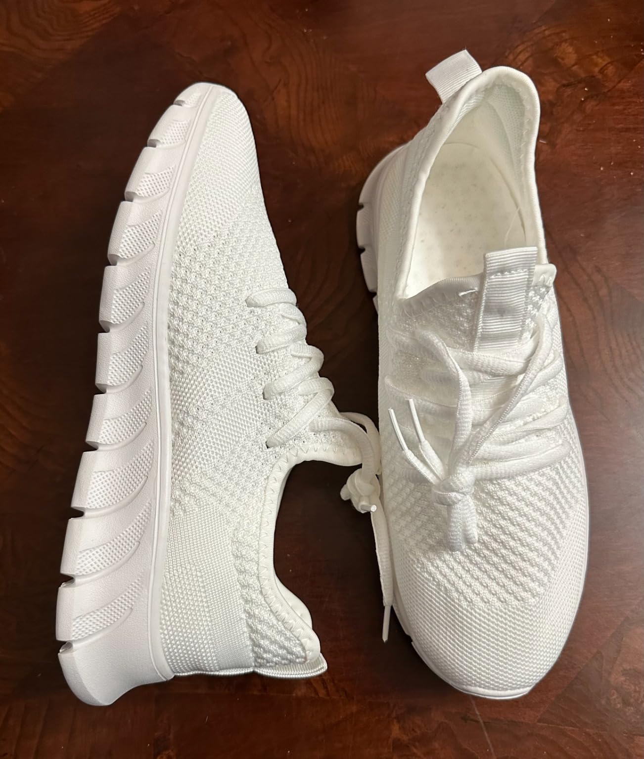 Women wearing white athletic sneakers showing casual styling and slip-on convenience