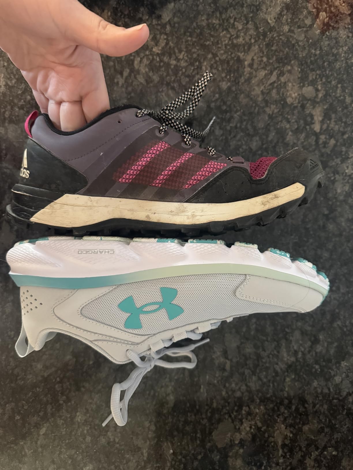 Under Armour Charged Assert 9 side profile showing mesh upper and leather overlays
