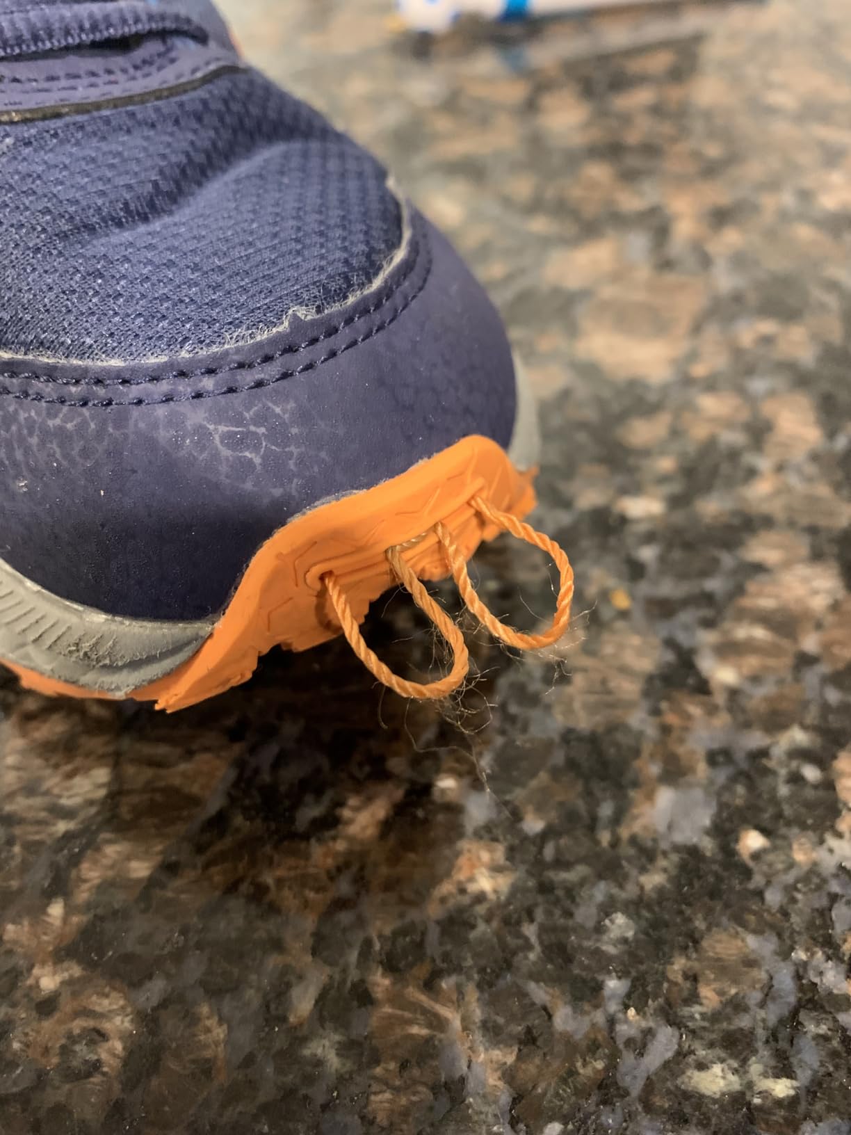 Close-up detail of ASICS PRE Venture 9 mesh upper construction and lacing system