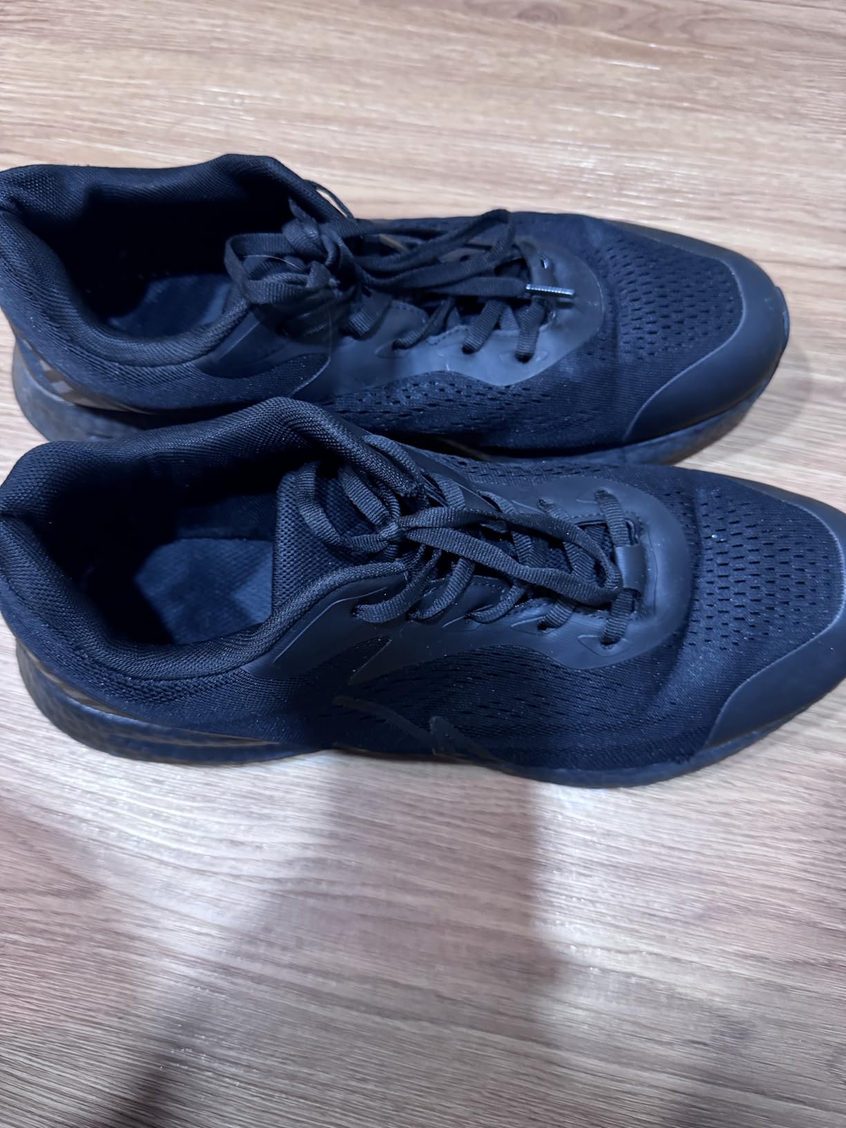 Hero image of the NY Threads Men's Running Shoes in black and white