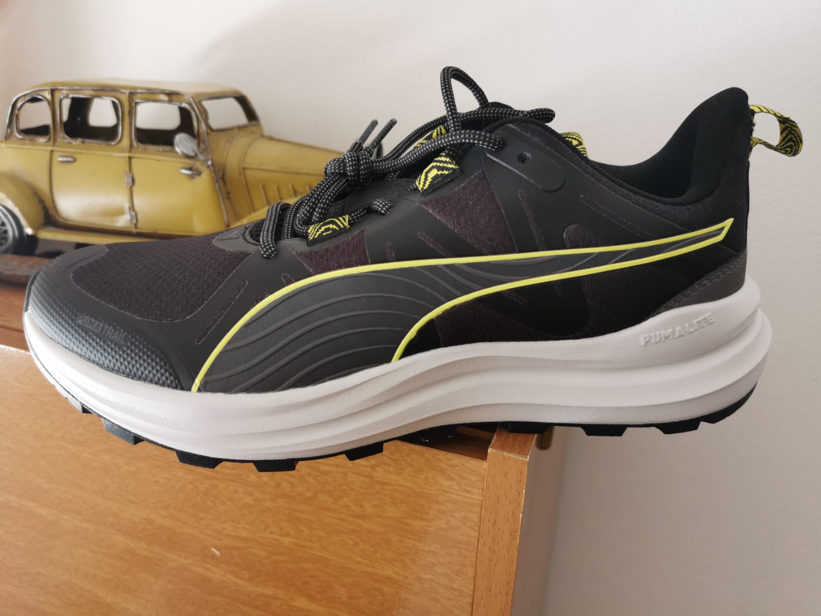 PUMA Reflect Lite Trail showing trail-ready lugged sole pattern and EVA upper durability after testing