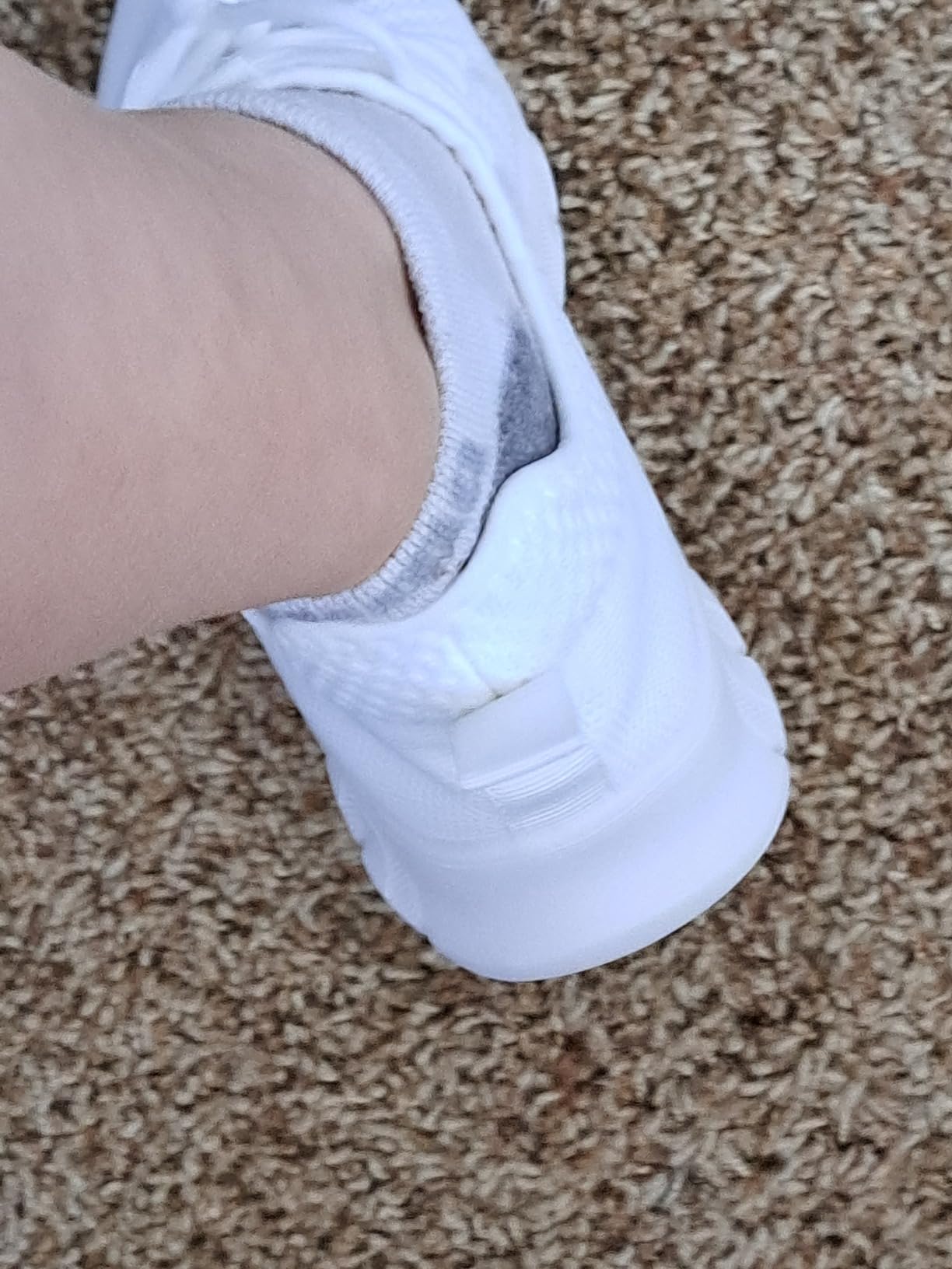 Side view showing lightweight mesh construction and slip-on design