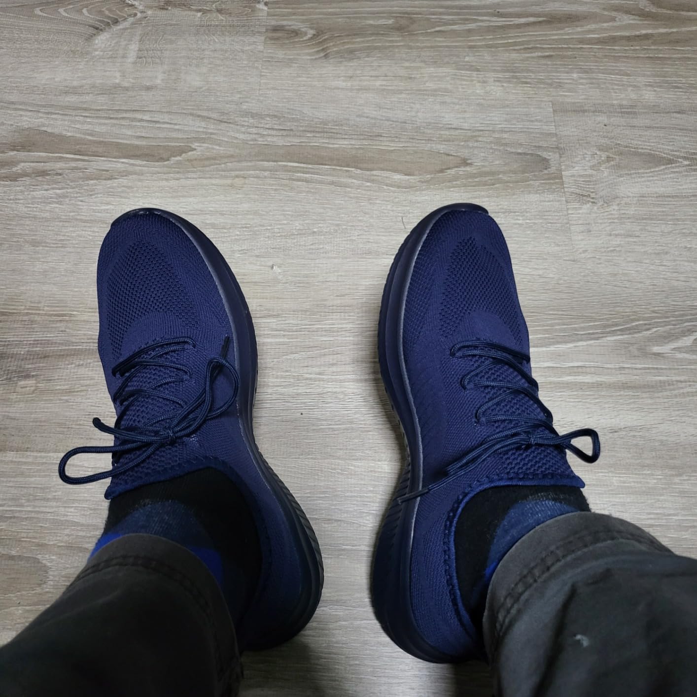 Bottom view of LCGJR shoes showing EVA outsole tread pattern and grip design