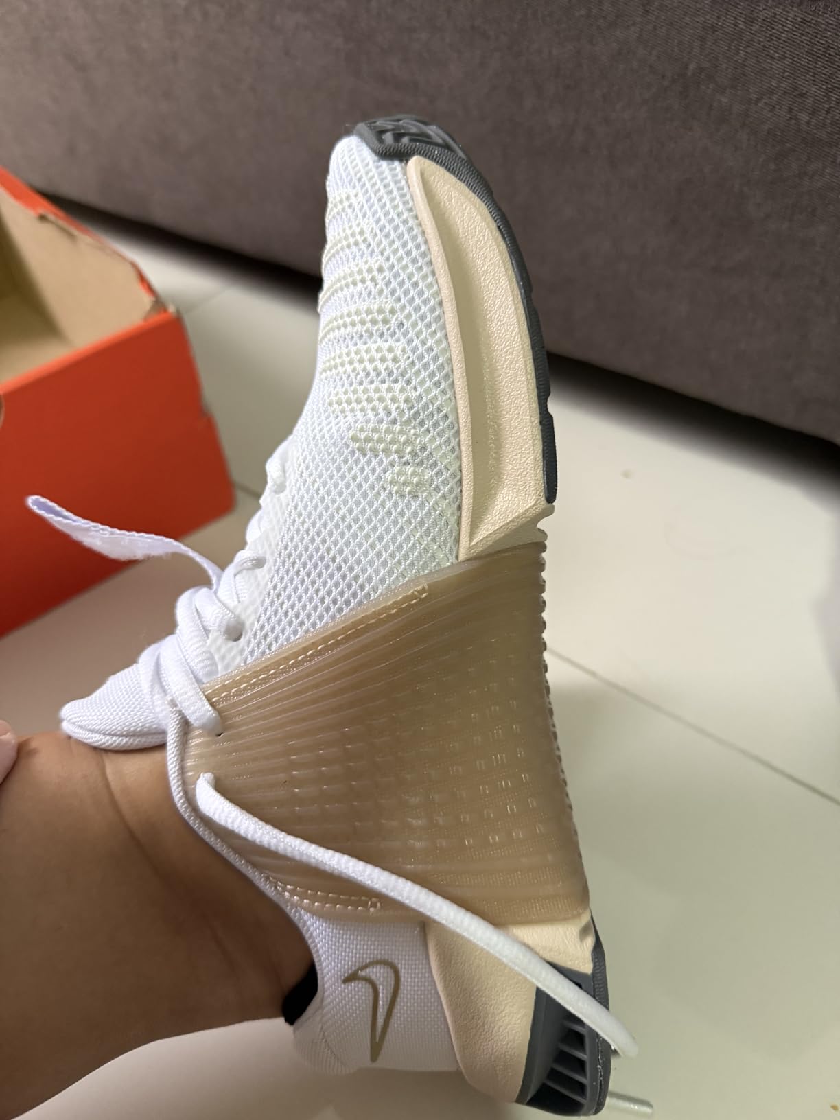 Nike Metcon 9 side profile showing extended rubber wrap and heel stability plate