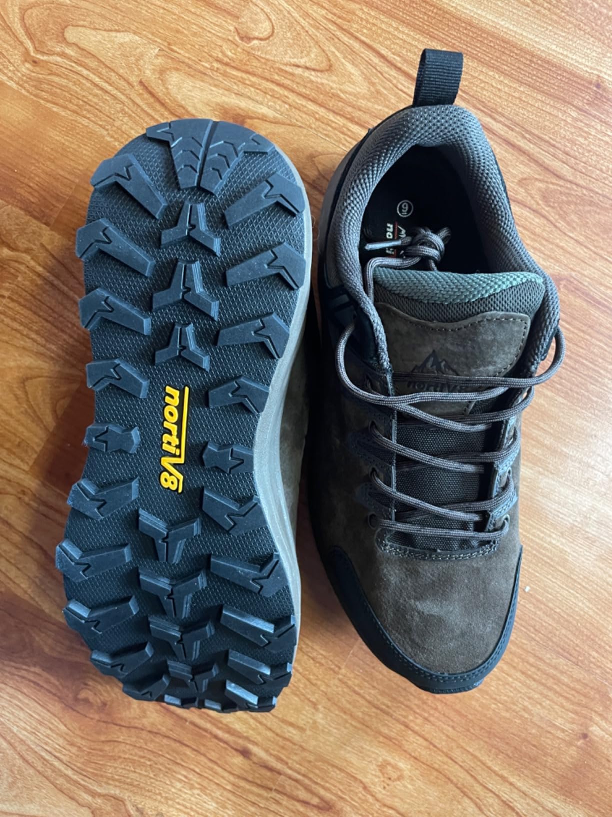 NORTIV 8 hiking shoes on rocky trail terrain showing aggressive rubber outsole tread pattern and ankle support