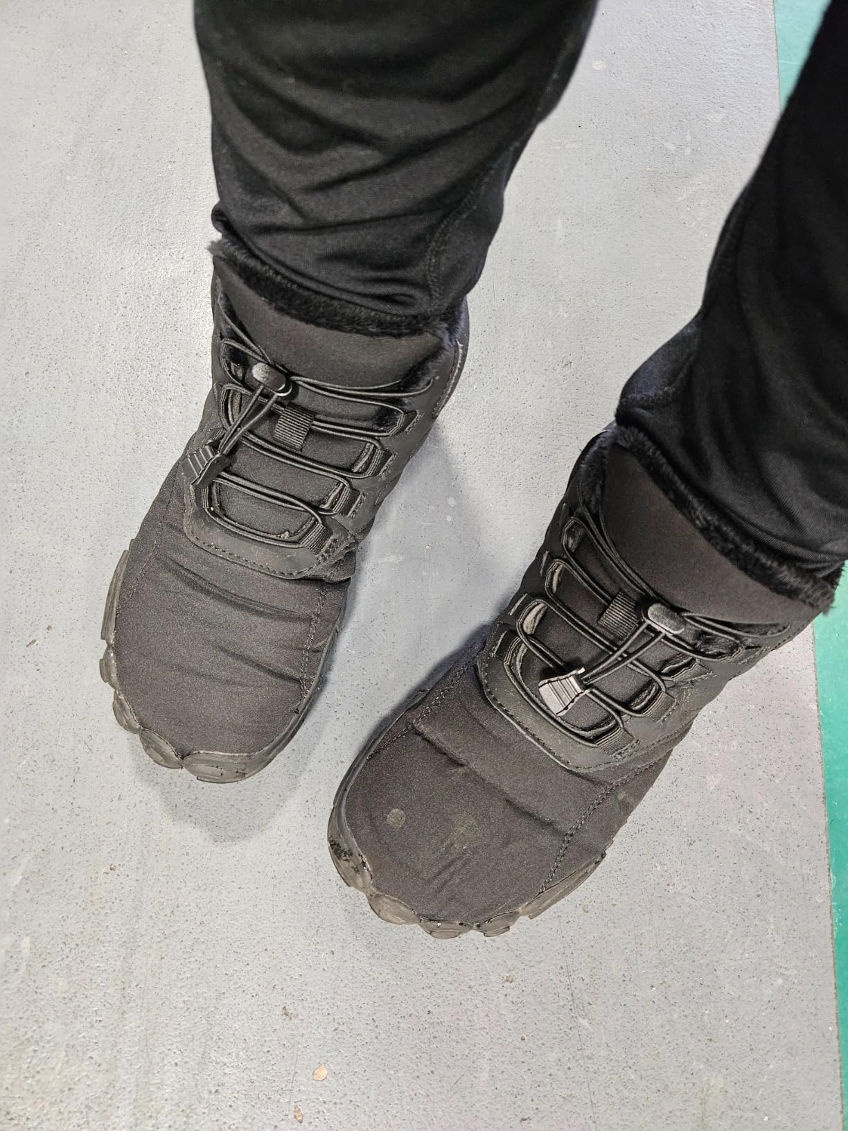Winter Hike Barefoot Boots on snowy trail showing tread pattern