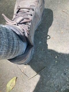 Merrell Moab Adventure Lace hiking shoes on desert trail showing red dust accumulation and real-world usage