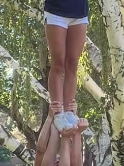 LANDHIKER cheer shoes team usage showing multiple pairs worn by cheerleading squad