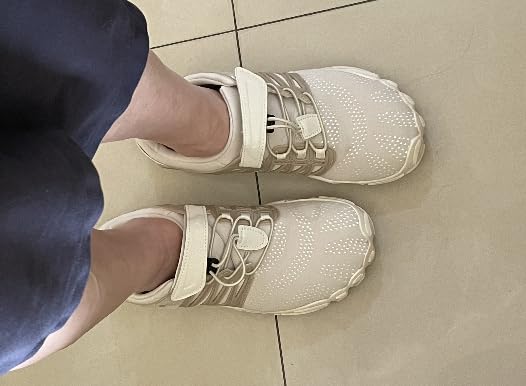Close-up of WHITIN barefoot shoe construction showing engineering knit upper and hook and loop closure
