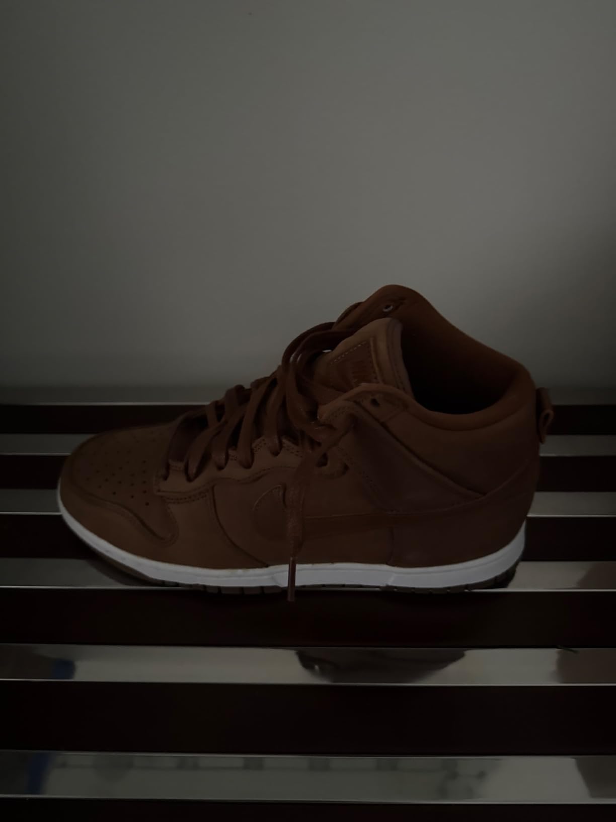 Nike Women's Hi-top Trainers detail showing perforated leather upper and hook loop closure system