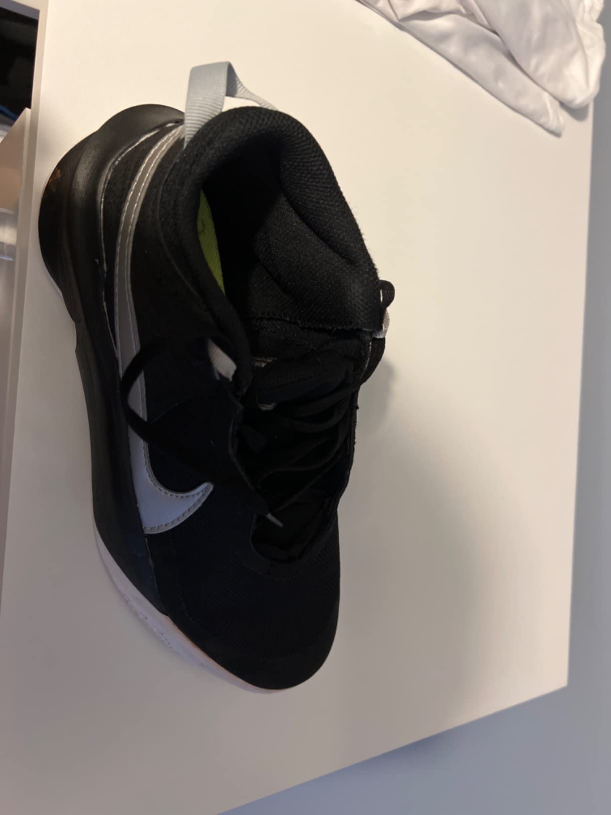 Nike Team Hustle D 10 action shot showing performance during basketball movement