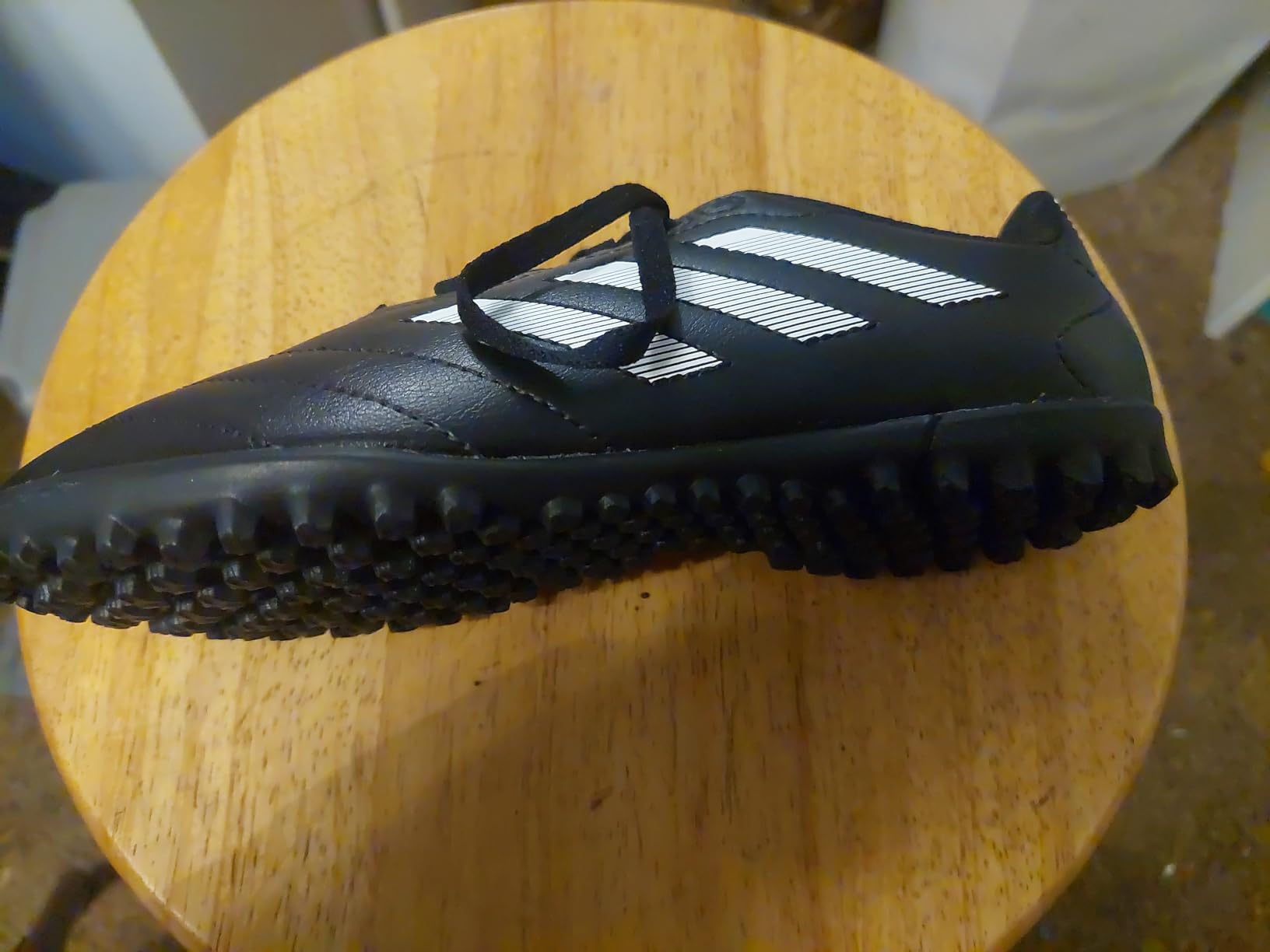 Adidas Kids Goletto soccer shoe side view showing synthetic upper construction and lace system