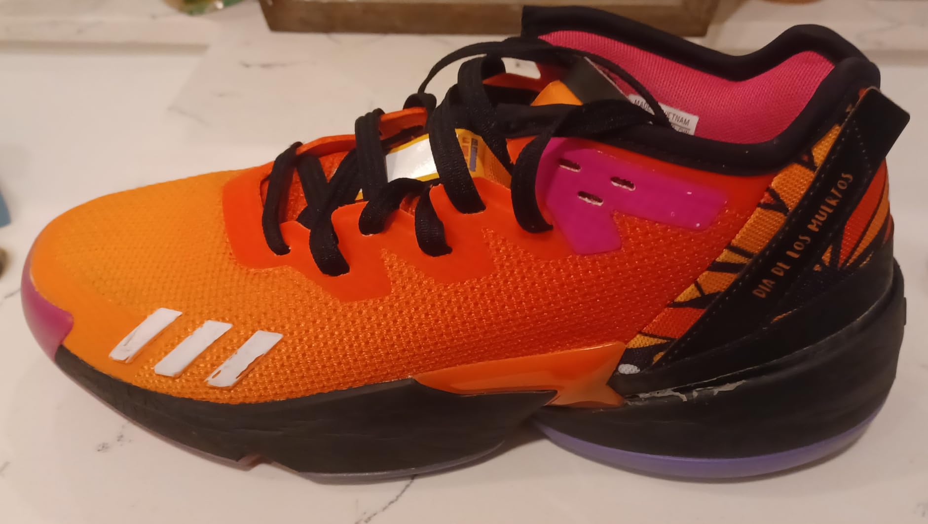 Side view of D.O.N. Issue 4 showing low-profile design and ankle support