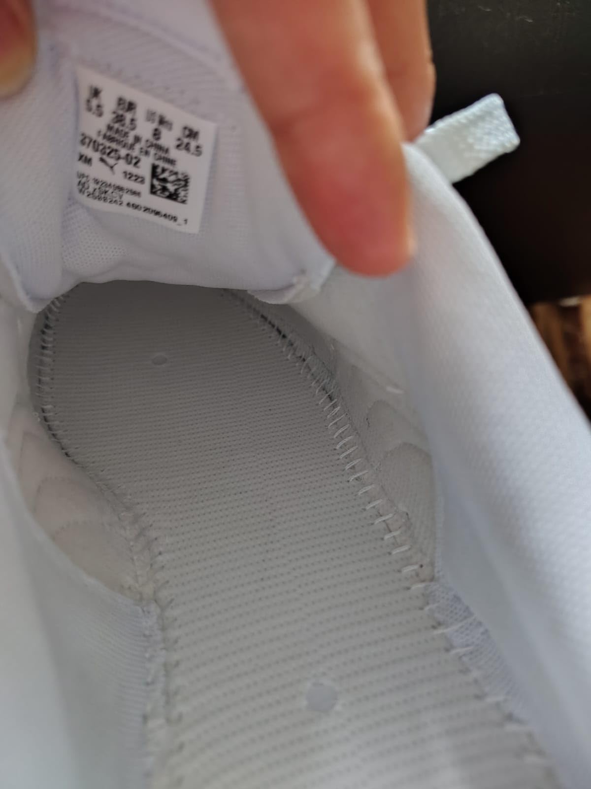 PUMA Carina L sneaker detailed side view showing leather construction and platform sole