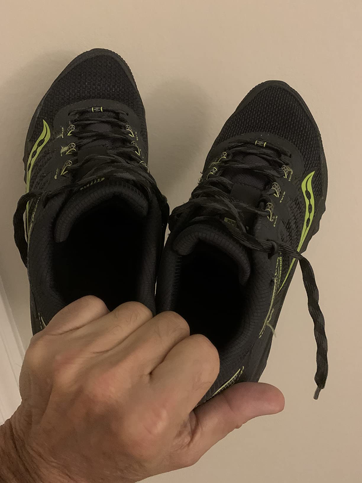 Saucony TR13 shoes worn on trail showing real-world usage and dirt accumulation