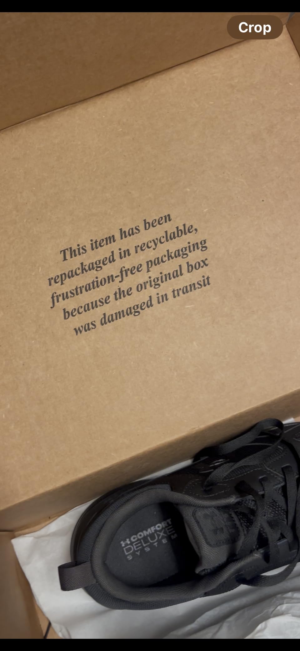 Under Armour logo and branding on Charged Edge sneaker showing quality construction details