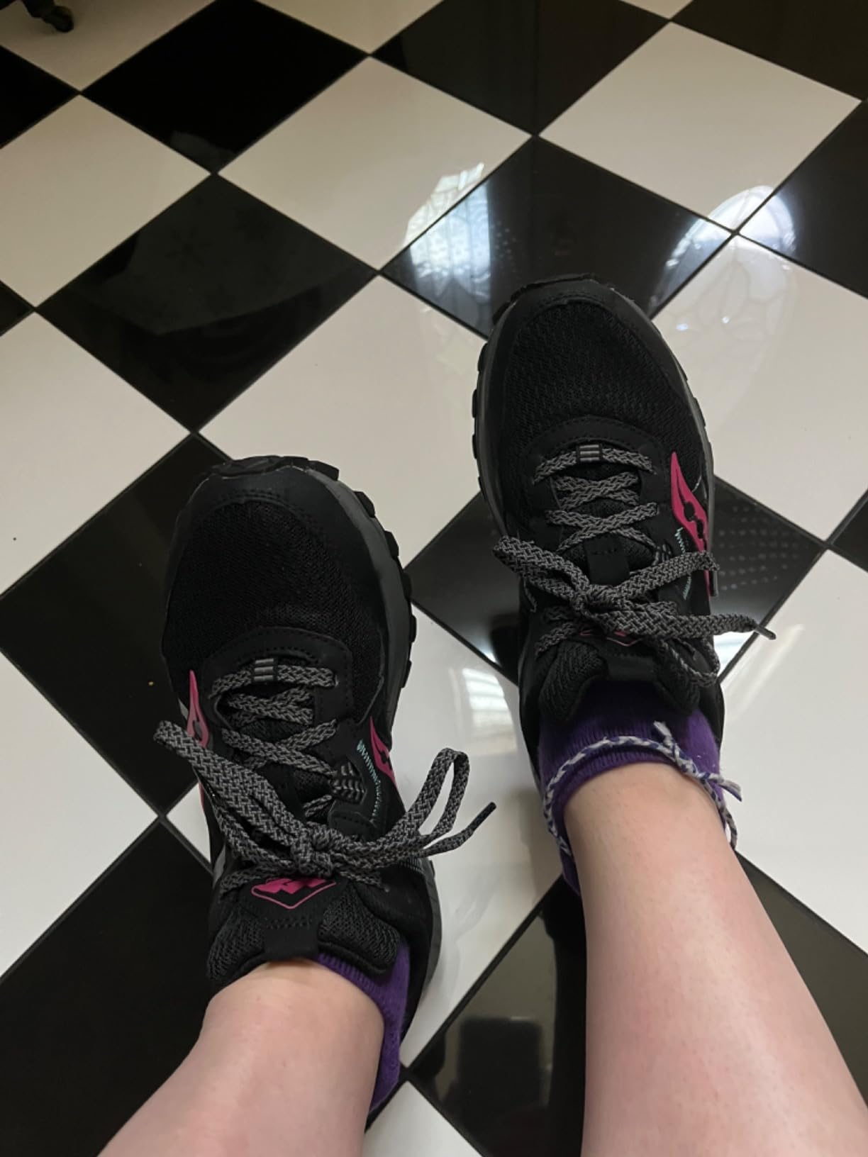 Bottom view showing carbon rubber lug pattern and 4.5mm tread depth on Saucony TR16