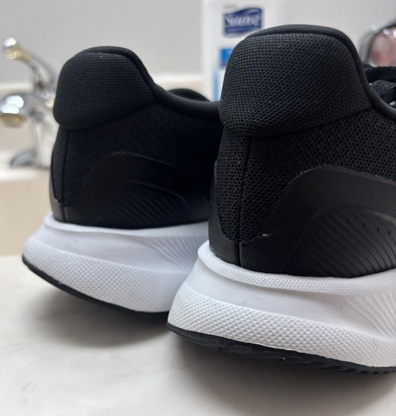 Close-up detail of Adidas Run Falcon 5 showing mesh upper construction and lace closure system