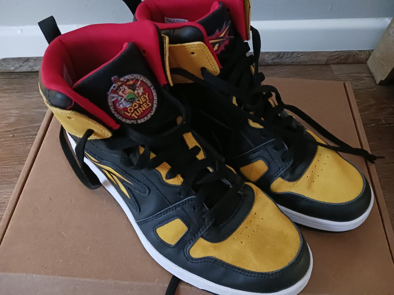 Reebok Resonator Mid basketball shoes in action during game play showing movement and support