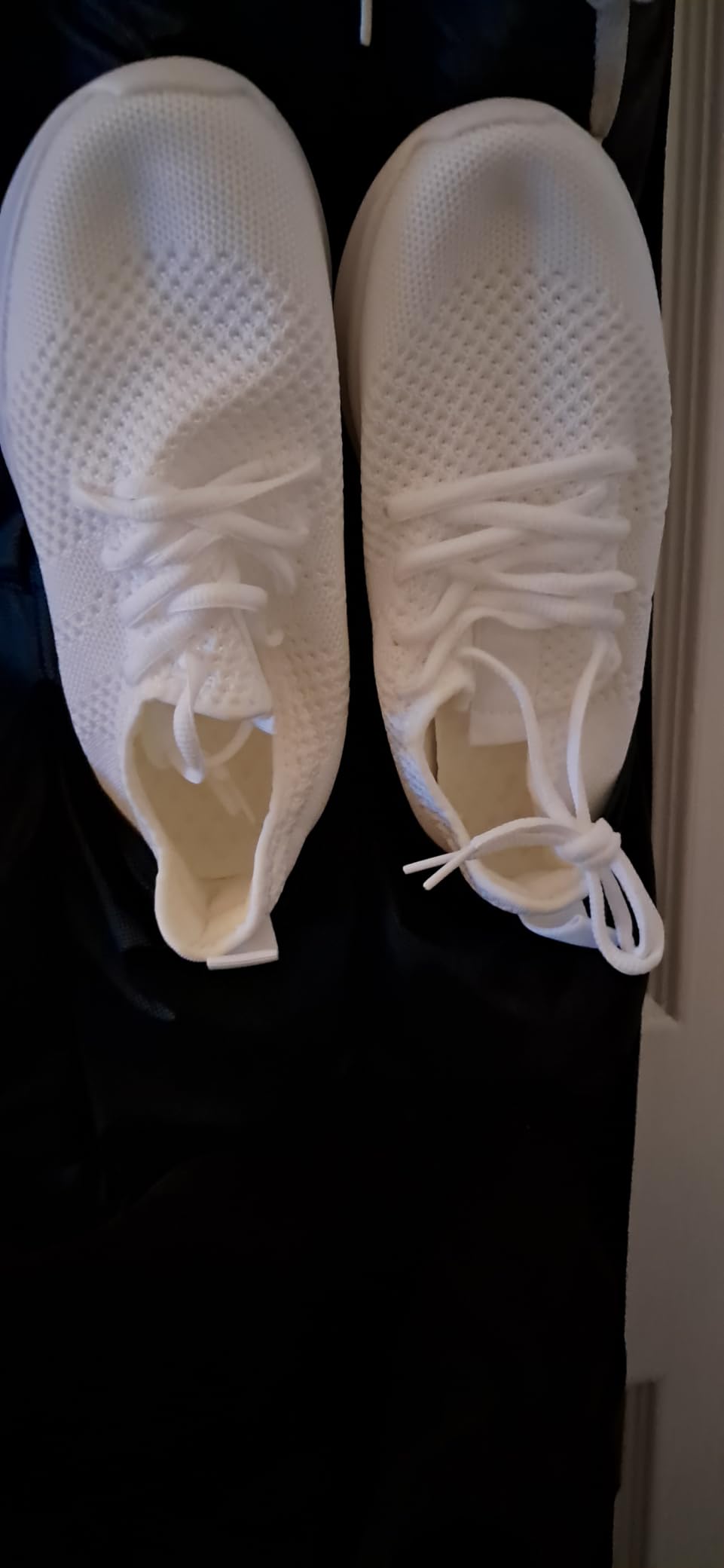 Bottom sole view of WYGRQBN women's walking shoes showing tread pattern and EVA material construction