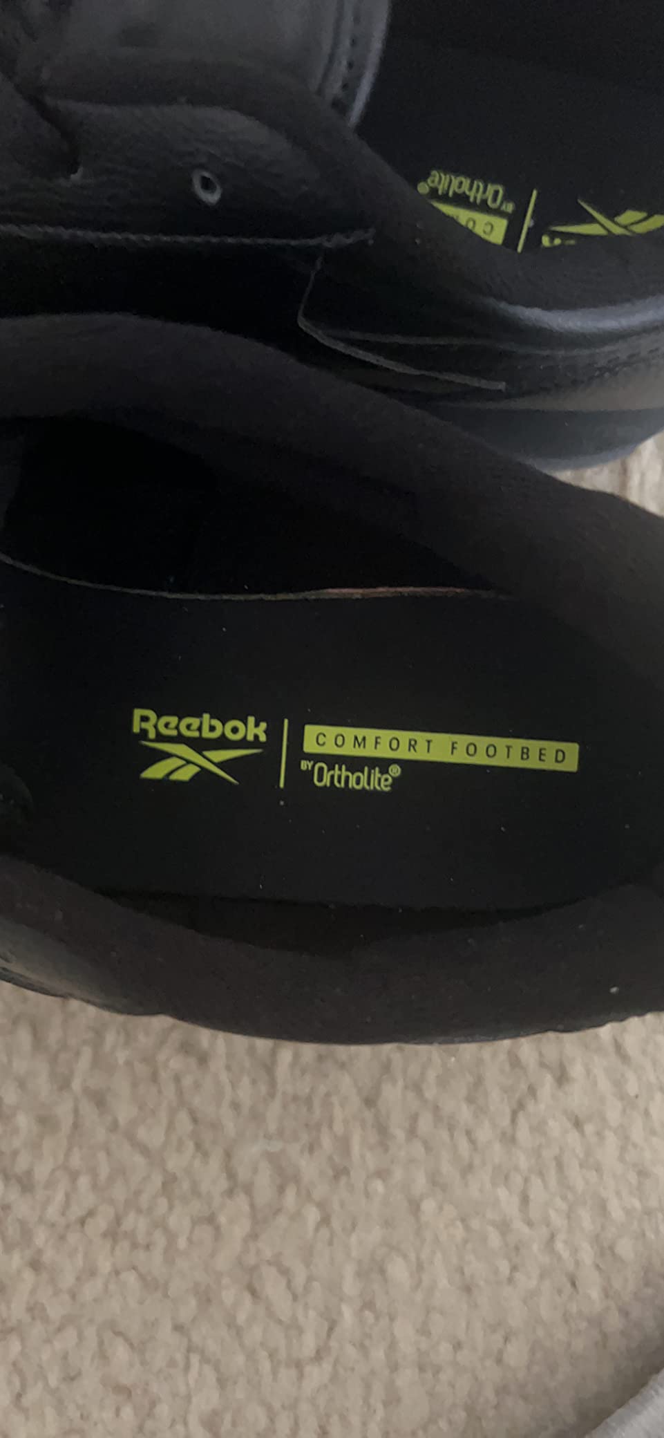 Close-up view of Reebok Classic Renaissance leather upper showing stitched overlays and branding details