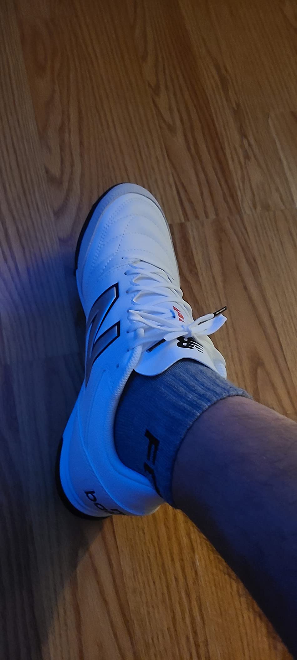 New Balance 442 V2 in action showing performance on artificial turf field