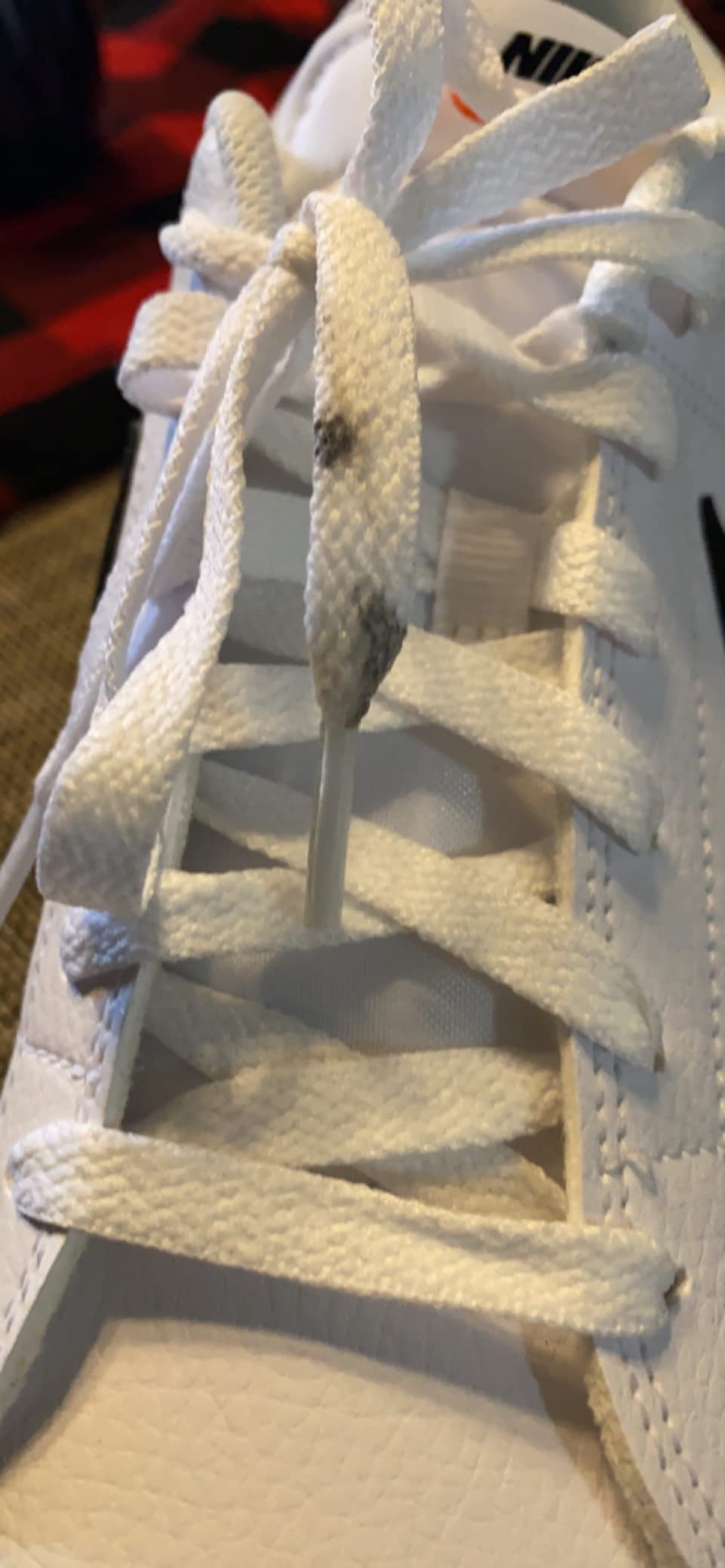Nike Air Force 1 showing wear and tear issues including dirty laces and scuff marks from real use