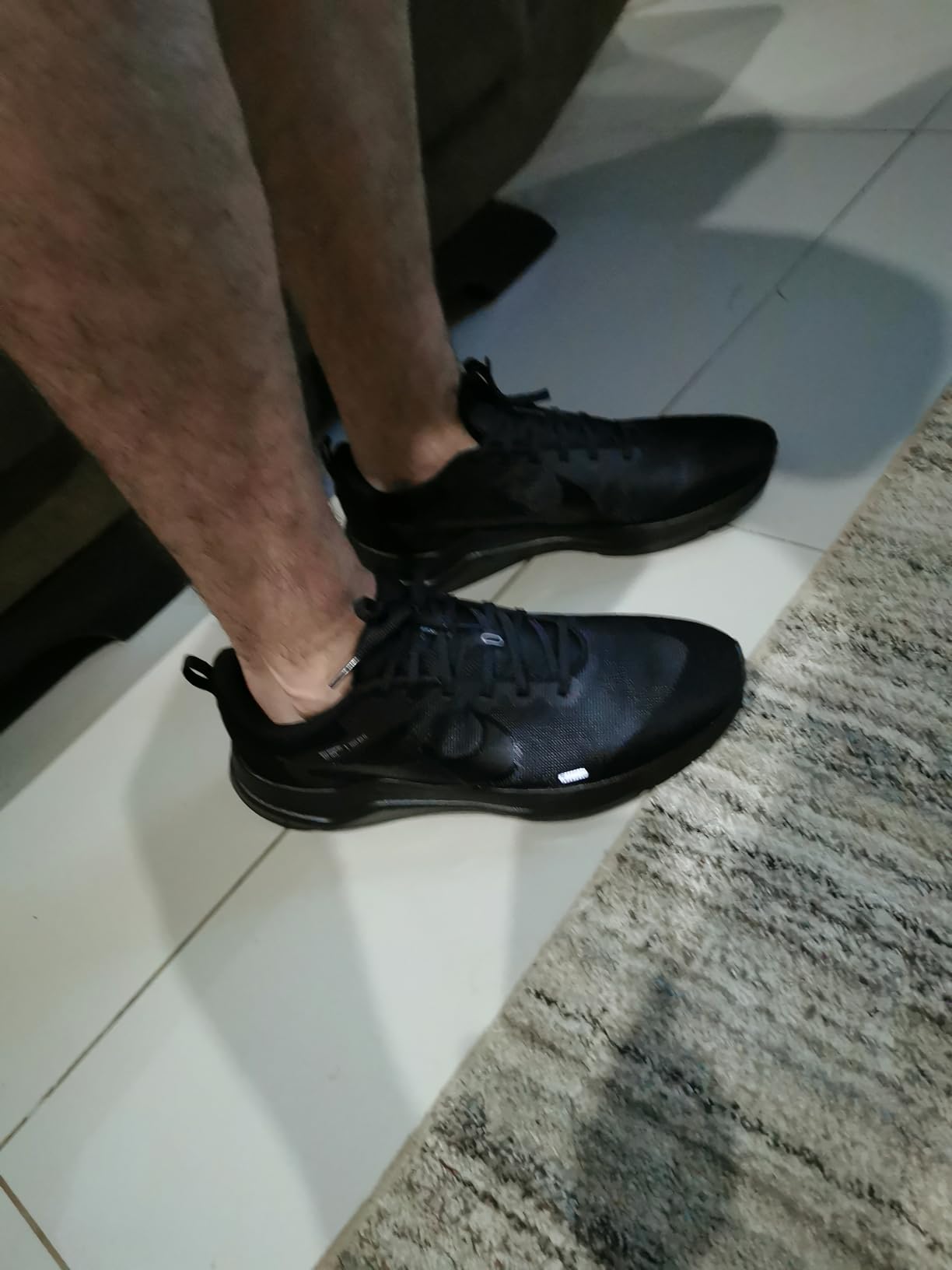 Nike Men's Downshifter 12 final product shot showing complete shoe from multiple angles for purchasing decision