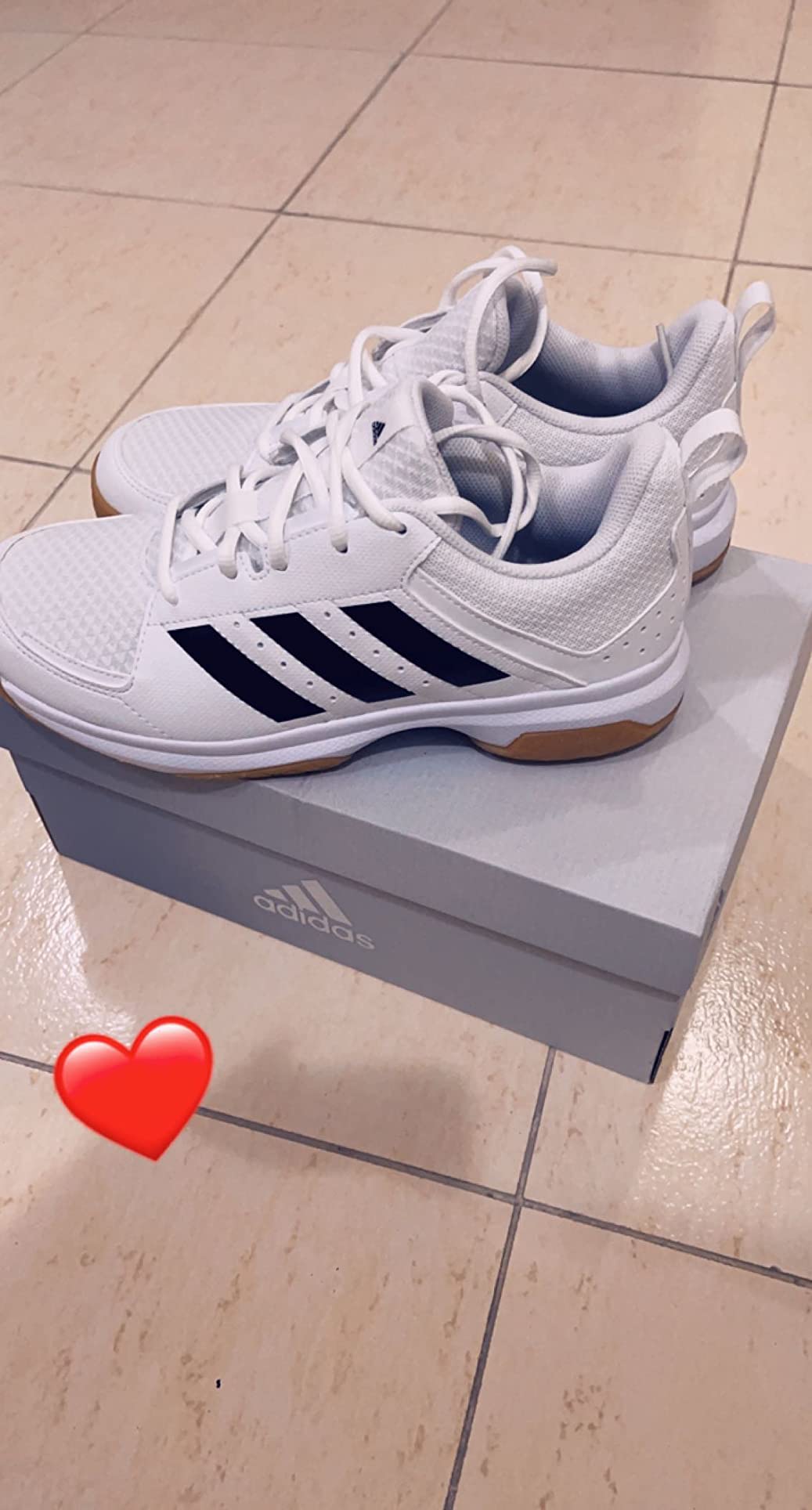 adidas Ligra 7 court action shot showing traction and stability during sports movement