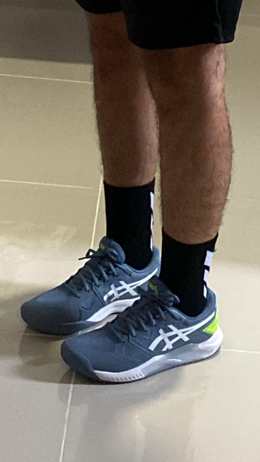 Multiple ASICS Gel-Challenger 13 tennis shoes showing different colorway options