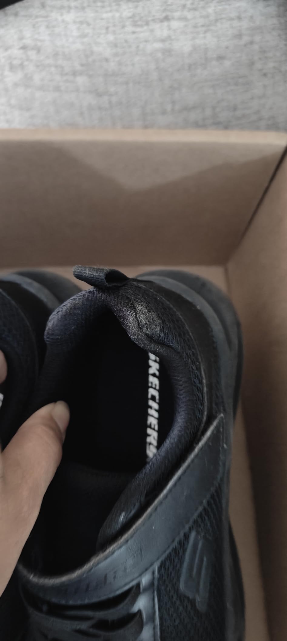 Skechers Dynamatic showing hook and loop strap closure and stretch lace system
