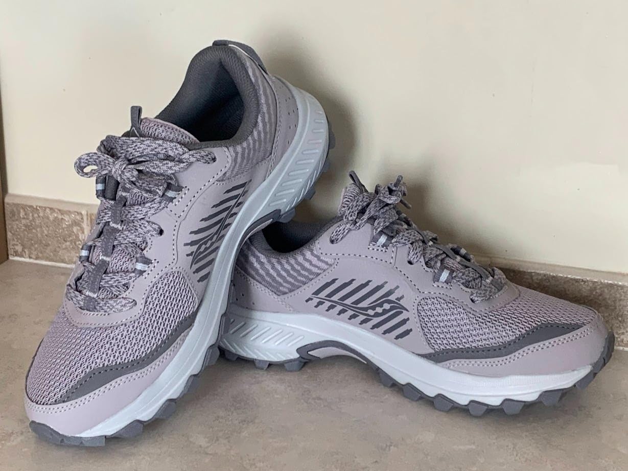 Action shot of Saucony Excursion TR15 on natural trail terrain showing real-world hiking performance