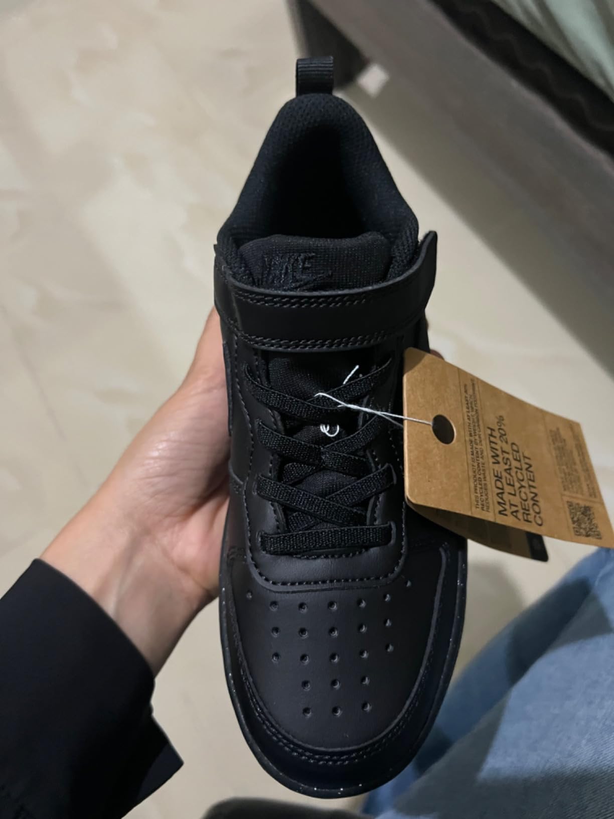 Nike Boy's Sneaker showing wear patterns after extended use with focus on sole durability