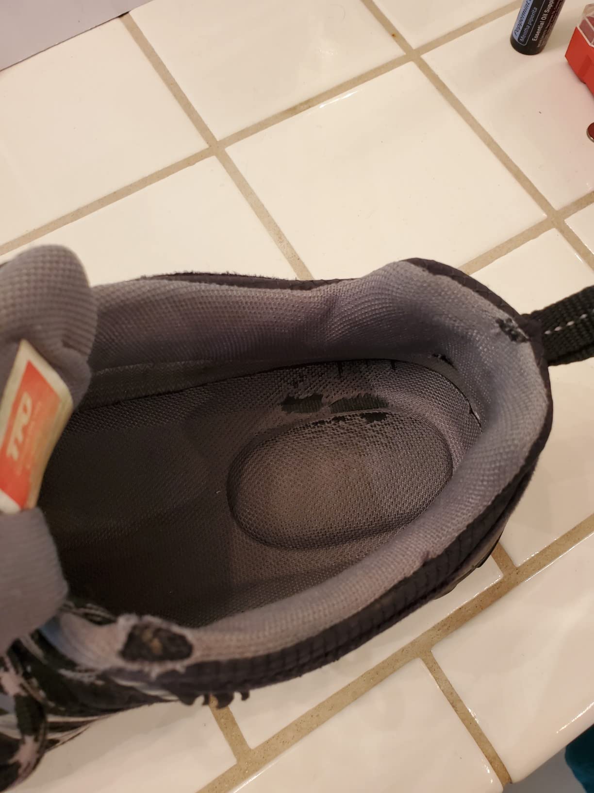 TFO hiking shoes detail display showing protective toe cap, ankle support, and anti-slip rubber outsole