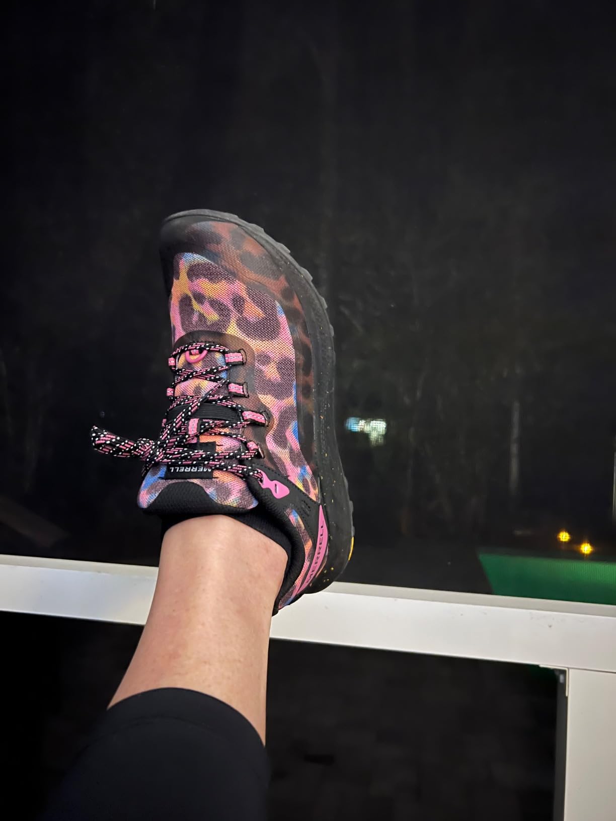 Close-up detail of Merrell Antora 3 showing mesh upper construction and lacing system