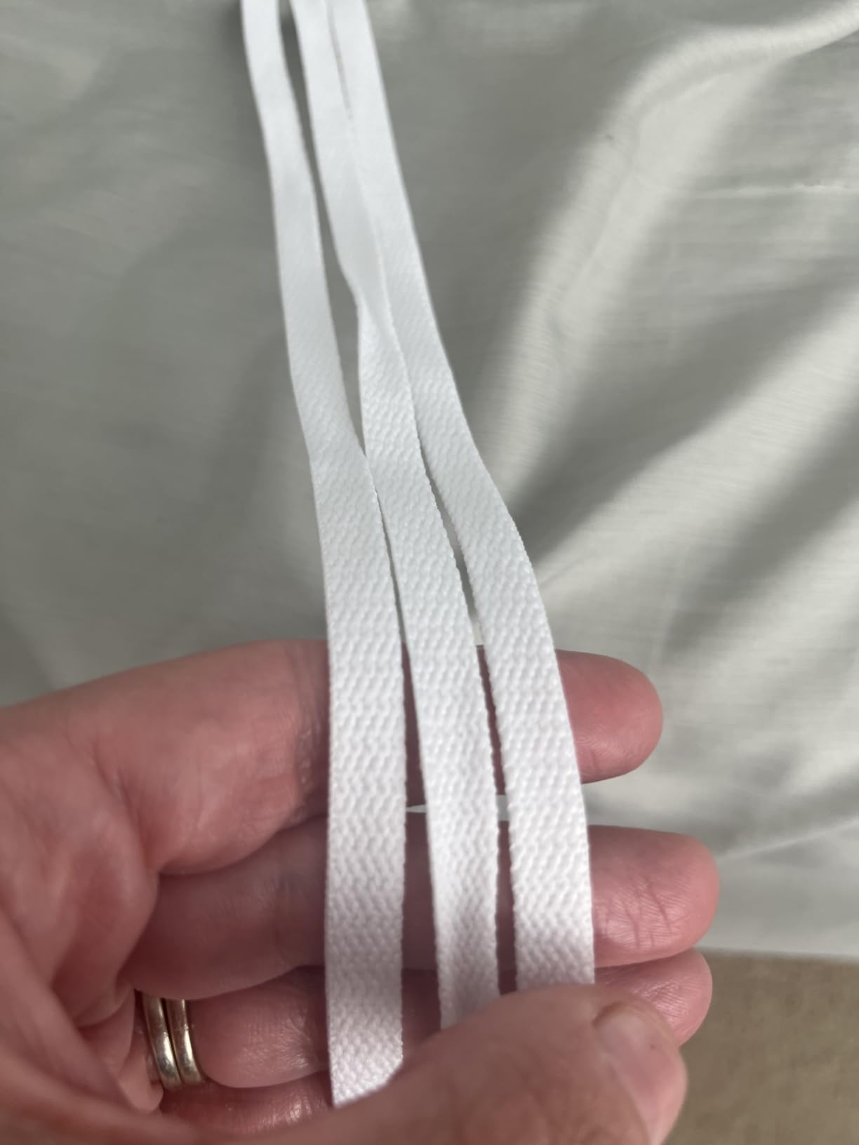 UpUGo 3 pair flat white shoelaces package showing multiple length options and quality construction