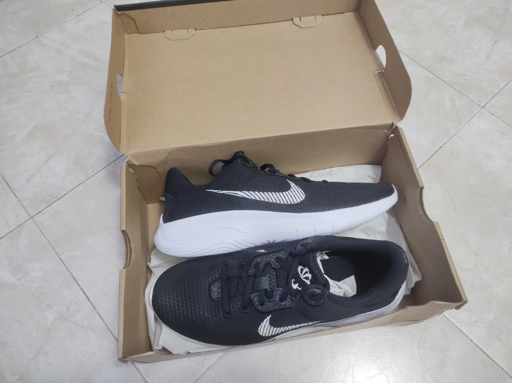 Nike gymnastics shoes detail showing mesh upper construction and rubber sole pattern