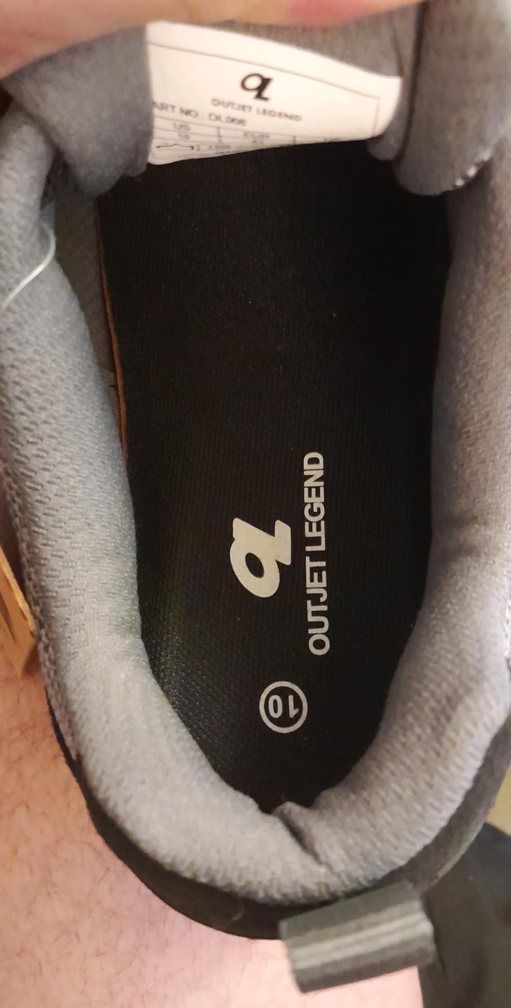 Close-up view of OL OUTJET LEGEND shoe construction showing leather upper materials and stitching quality