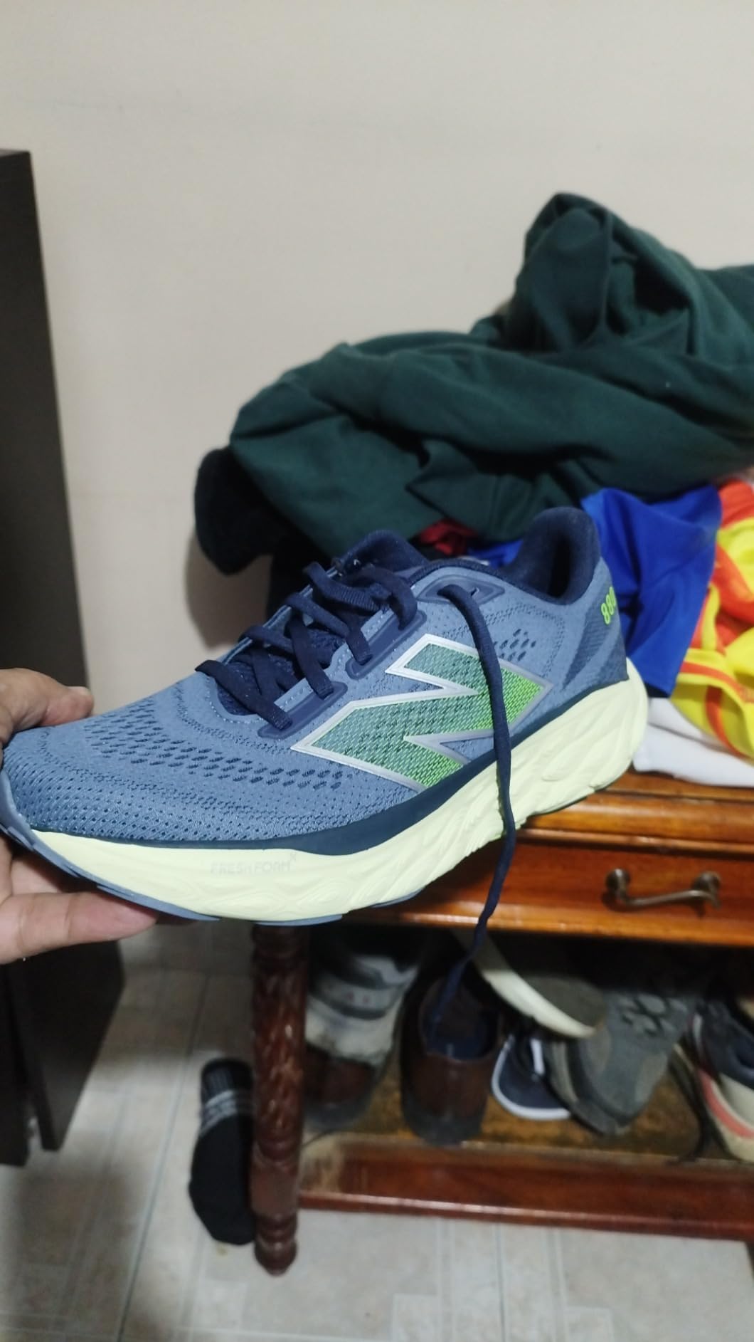 New Balance 880 V14 in action during road running showing dynamic heel to toe transition