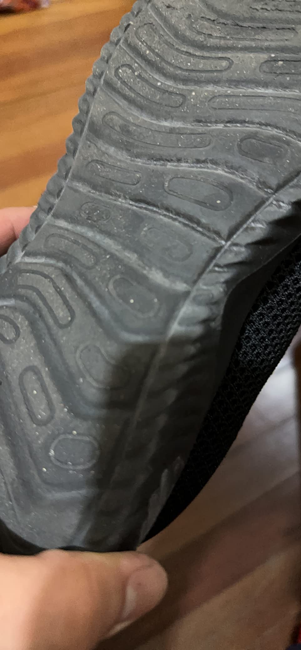 Close-up of mesh upper construction showing breathable fabric and slip-on design
