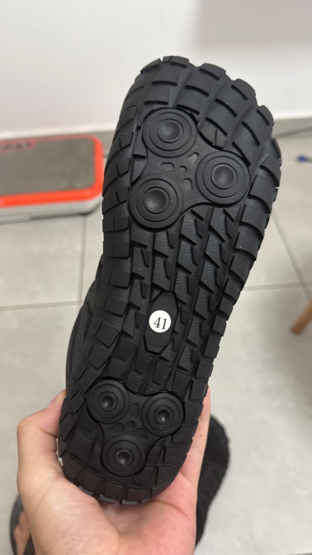 Side profile showing minimal heel design and breathable mesh construction for various activities