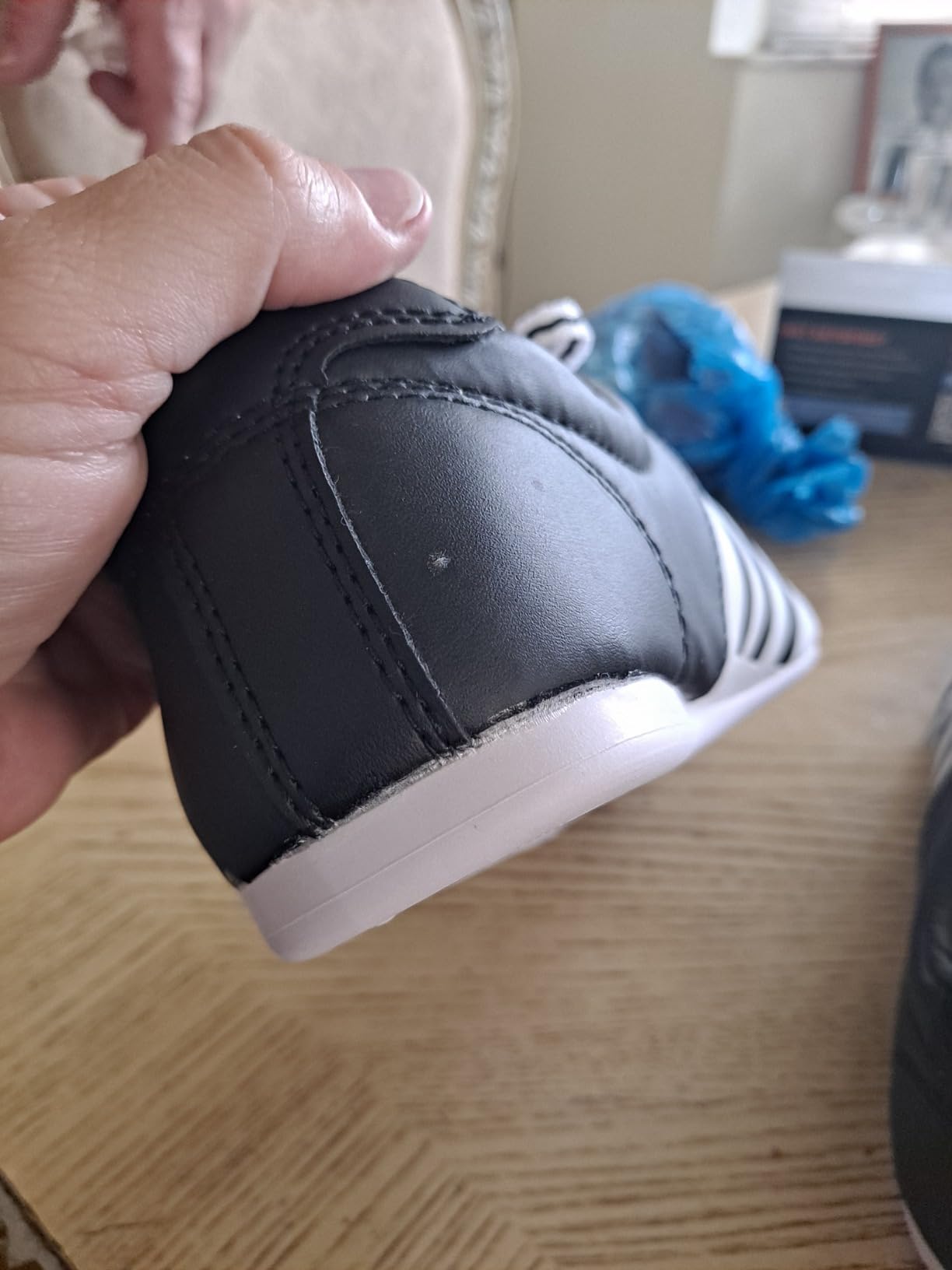 Adidas martial arts shoes showing construction quality and potential durability concerns at heel area